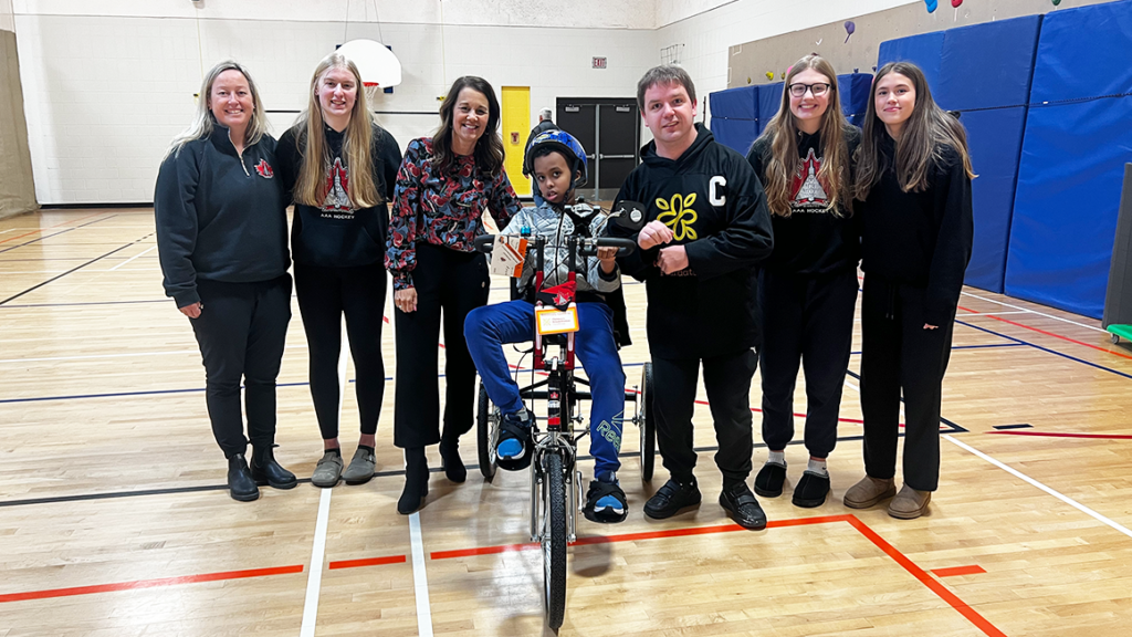 From left to right: Ashley Van Aggelen, Avery Shortridge, Jane Kidd-Hantscher, a student at Lakewood School, Michael Gerl and two Avros players.