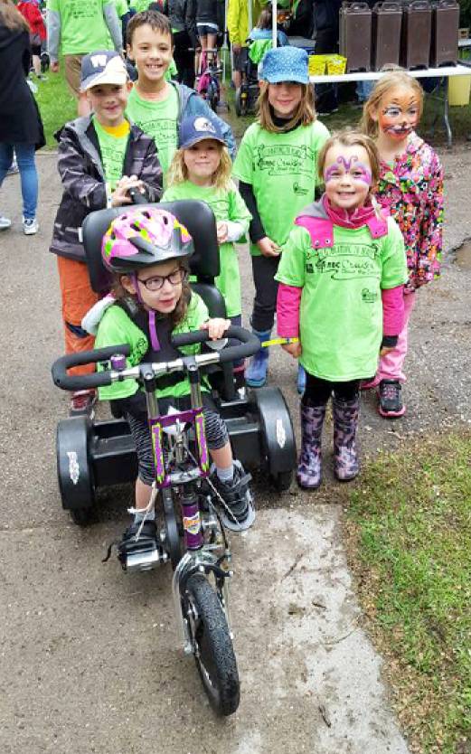 Kaity Linton (front) with the funders of her bike at this year’s RBC Cruisin’ Down the Crescent. (From back left) Zac Sidley, Sebastien Allard, Abi Chernichan, Lia Chernichan, Ava Allard and Annik Allard.